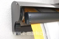 half-cassette awning, rain awning cover, awning protection half-cassette. The photo shows an example of attaching the half-cassette to the Jamaica awning.