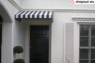 Triangular basket awning with a wavy valance and an aesthetic border in the color of the structure