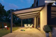 Patio with polycarbonate roofing and warm LED strip lighting installed on the beams of the roof