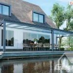 Gumax winter garden by the lake with a sealed enclosure of sliding glass walls, allowing you to admire beautiful views