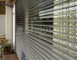 Facade blinds with open louvers