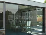 Sliding glass walls for pergolas and garden structures