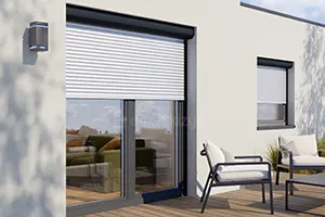 Surface-mounted blind on patio doors and window in a single-family house with beige plaster